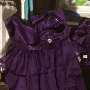 Purple ruffled dress with gem flower